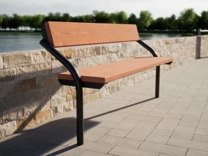 Park bench out of metal and wood with backrest on the coast